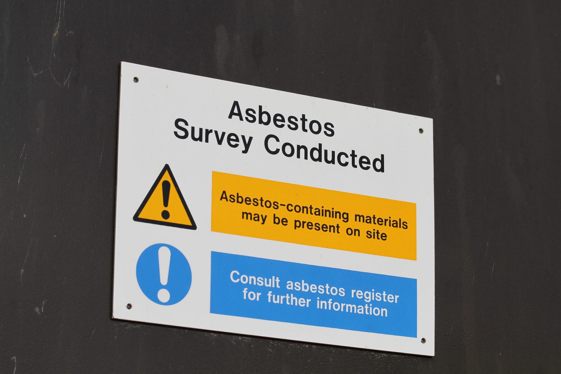 Sign warning of possible asbestos contamination and danger to health.